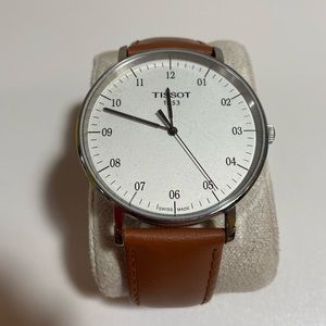 Tissot Mens brown leather watch with silver accents